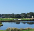 The par-3 12th hole on Palmetto Dunes Resort's Oceanfront Course features a long carry over water to an elevated green.