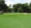 The 18th green at Morgan River at Dataw Island Golf Course puts a earthen barrier across the fairway to preclude bump and runs to the green and a matching set of bunkers to imperil short iron shots.