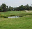 The ninth hole on Callawassie Island Club's Palmetto golf course slopes left toward a second-half water hazard. It's a tricky hole where shot placement needs to be an exact science.