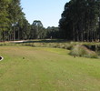 The 11th hole requires a long, straight tee shot to navigate between water fore and right and a bunker left at the Planter's Row course at Port Royal Golf Club.