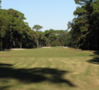 The 18th hole is one last march between the timber, with extra sand on the left and water right for added enjoyment at the Planter's Row course at Port Royal Golf Club.