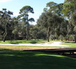 Harbour Town Golf Links's seventh hole, a par 3, has a tiny green surrounded by a desert and guarded atop by a tree-branch canopy. 