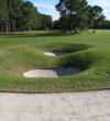 Landing in one of series of pot bunkers behind Harbour Town Golf Links's ninth green could lead to another sand shot from the front side. 