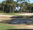 The sixth green at Fripp Island's Ocean Point Golf Links is guarded by water on two sides, sand on another.