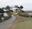 The 17th hole at Old Tabby Links on Spring Island, S.C., is the signature hole, a wicked little hole teetering between a pond and marsh.