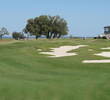 The offset ninth green on the Dye golf course at Colleton River Plantation pulls large bunkers into play.