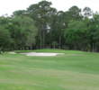 The 18th green at Crescent Pointe Golf Club has bunkers left and a drop-off into trees just about everywhere else.