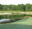 The par-3 second hole at Crescent Pointe Golf Club requires a lot of carry to avoid water and sand.