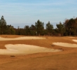 Bunkers ring the 10th green of the Golf Club at Hilton Head Lakes in Hardeeville, S.C.