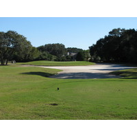 Sand nearly surrounds the elevated green on the par-3 15th hole at Robber's Row at Port Royal Golf Club.