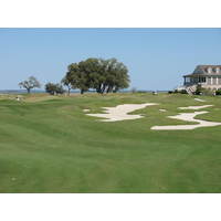 The offset ninth green on the Dye golf course at Colleton River Plantation pulls large bunkers into play.