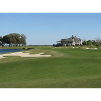 The 18th green on the Dye course at Colleton River Plantation is ringed with sand and water.