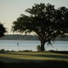 A view of a green with water in background at Haig Point Club