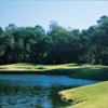 A view of a green with water and bunkers coming into play at Sea Pines Country Club