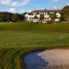 A view of a green and the clubhouse at Country Club of Hilton Head