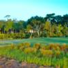 A sunny day view of a hole at Old Tabby Links