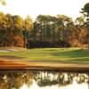 A sunny day view of a hole at Hilton Head National Golf Club