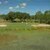 A view of a hole flaked bu bunkers at Moss Creek Golf Club.